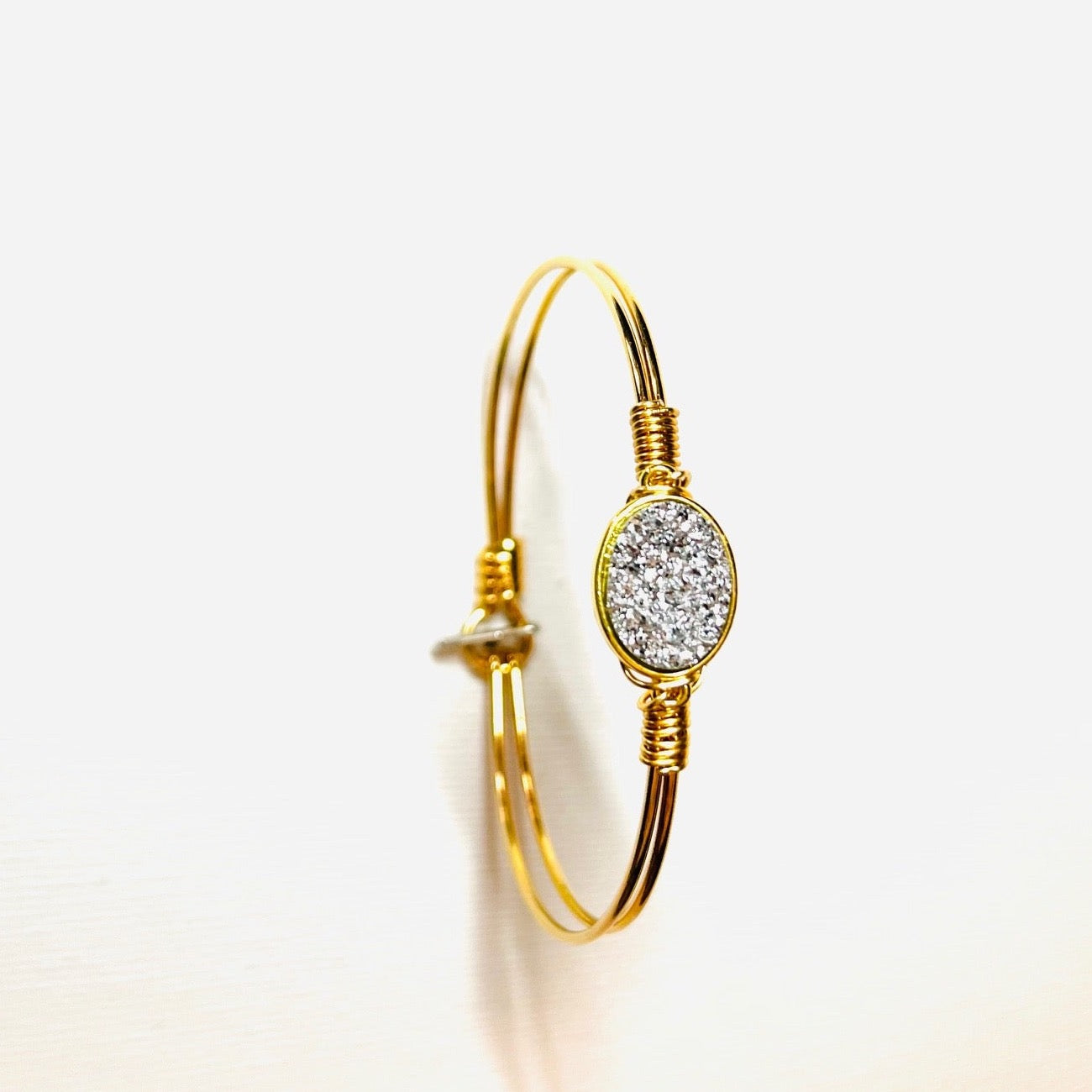 Gem Stone Look Charm Bracelet Plated 22k Gold or Platinum with Gem Stone Look Charm Hand Wired to Bracelets. Colors Hot Pink, Pink, Green, Metallic Purple, and Silver. Choice of Bracelets Plated 22 Gold or Platinum .