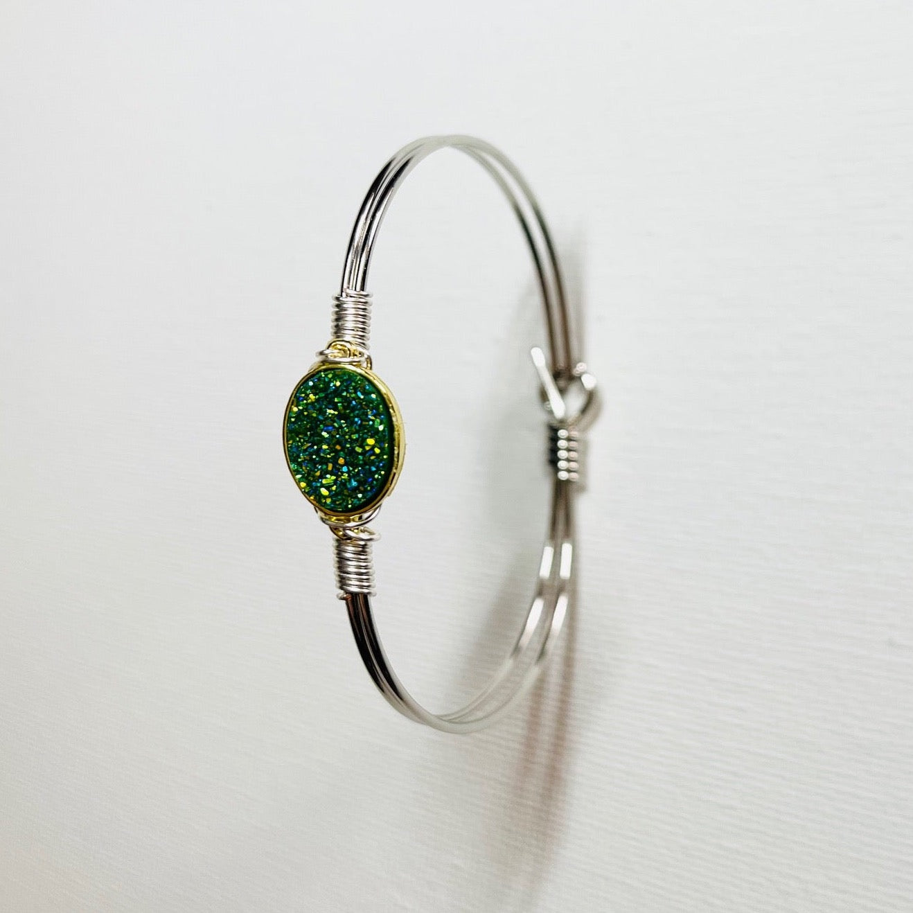 Gem Stone Look Charm Bracelet Plated 22k Gold or Platinum with Gem Stone Look Charm Hand Wired to Bracelets. Colors Hot Pink, Pink, Green, Metallic Purple, and Silver. Choice of Bracelets Plated 22 Gold or Platinum .