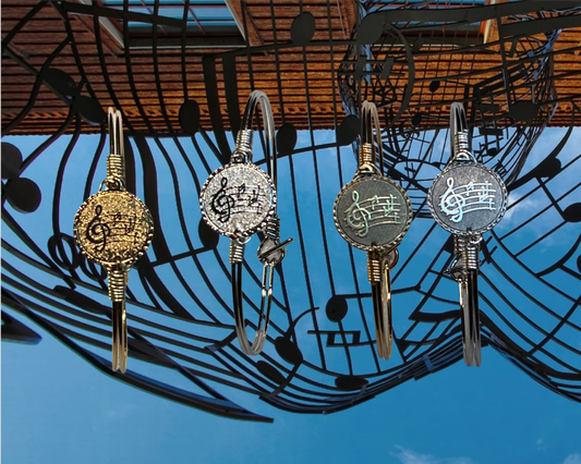Music  Coin Bracelets Played 22k Gold, Platinum, with four Coins to chose  from  Plated 22k Gold, Platinum, Matt Gold ,and Matt Silver. Made by Hand In the USA.