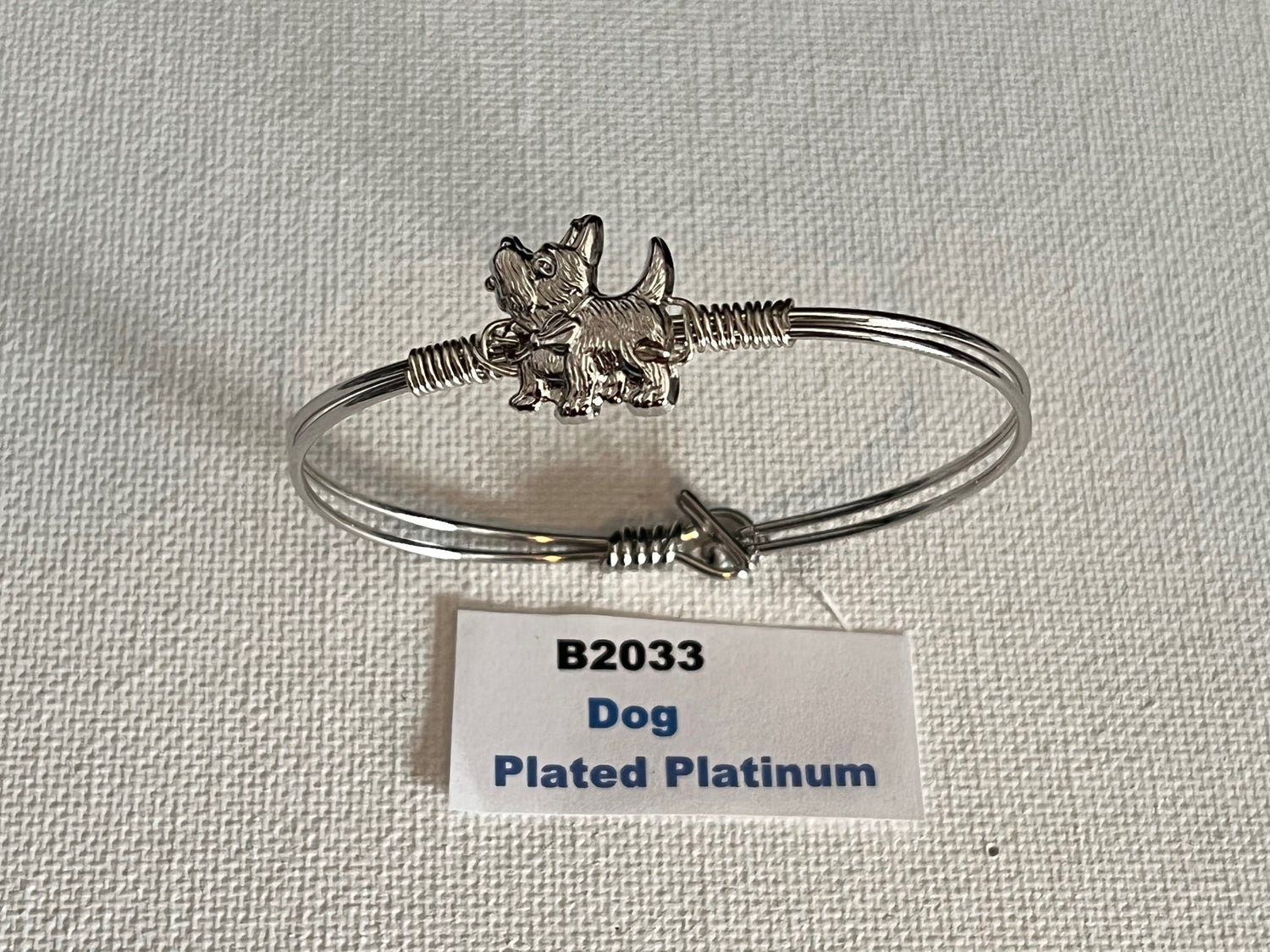 Oval Wired Bracelets with Charm (Various Style)  Styles Include:   22k Gold Plated Heart   22k Gold Plated Butterfly   22k Gold Plated Dog   Heart Platinum-Plated   Butterfly Platinum-Plated   Dog Platinum-Plated   22k Gold Plated Cowgirl Hat   22k Gold Plated Cat   Cowgirl Hat Platinum-Plated   Cat Platinum-Plated   