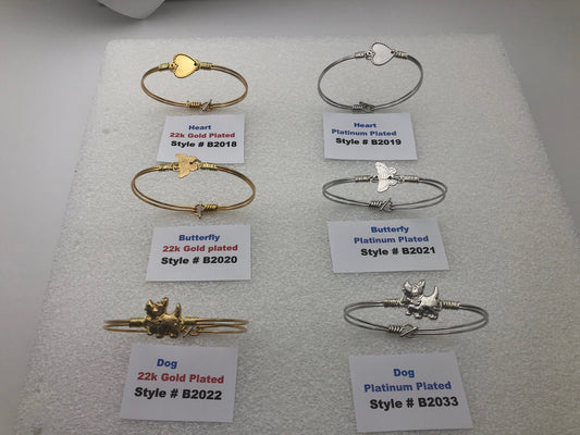 Oval Wired Bracelets with Charm (Various Style)  Styles Include:   22k Gold Plated Heart   22k Gold Plated Butterfly   22k Gold Plated Dog   Heart Platinum-Plated   Butterfly Platinum-Plated   Dog Platinum-Plated   22k Gold Plated Cowgirl Hat   22k Gold Plated Cat   Cowgirl Hat Platinum-Plated   Cat Platinum-Plated   
