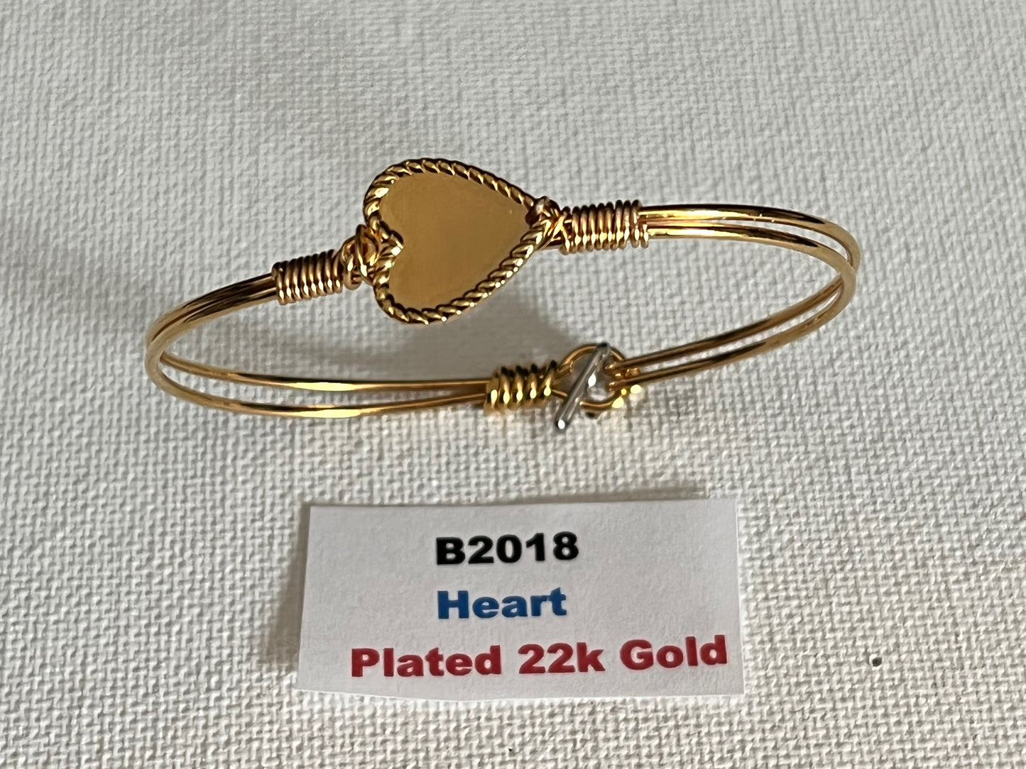 Oval Wired Bracelets with Charm (Various Style)  Styles Include:   22k Gold Plated Heart   22k Gold Plated Butterfly   22k Gold Plated Dog   Heart Platinum-Plated   Butterfly Platinum-Plated   Dog Platinum-Plated   22k Gold Plated Cowgirl Hat   22k Gold Plated Cat   Cowgirl Hat Platinum-Plated   Cat Platinum-Plated   